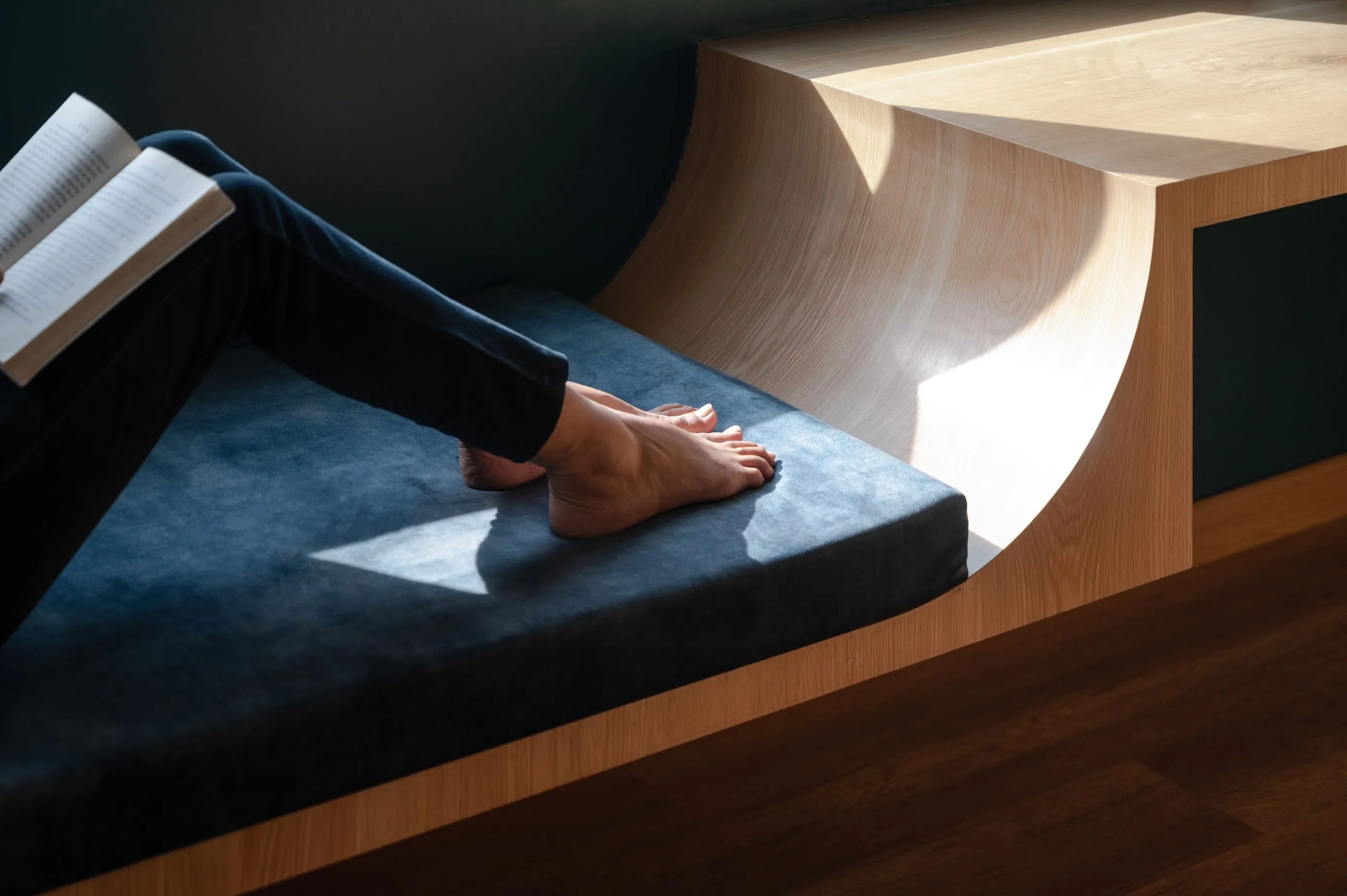 A bedroom alcove with built-in diwan seating