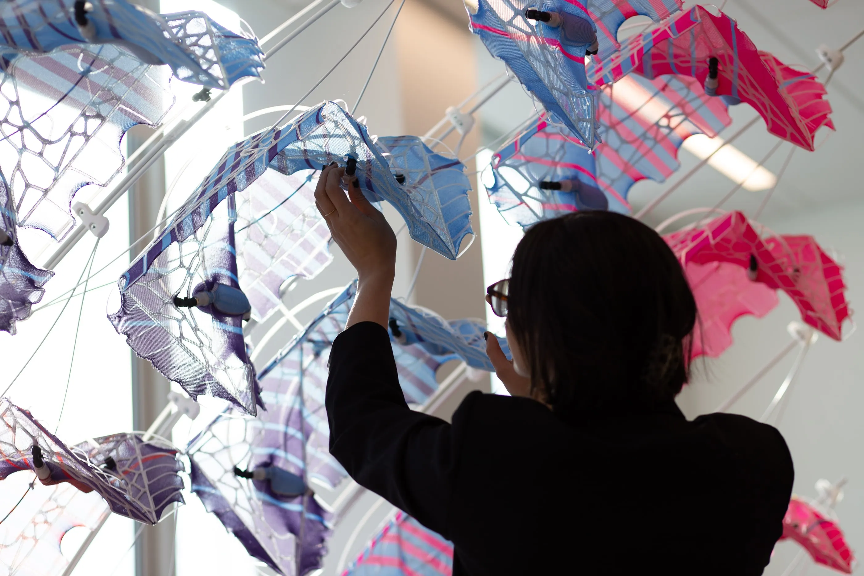 Two visitors interacting with the modules